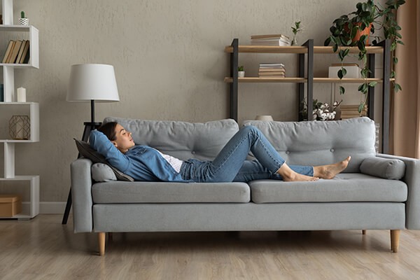 Woman relaxing on sofa