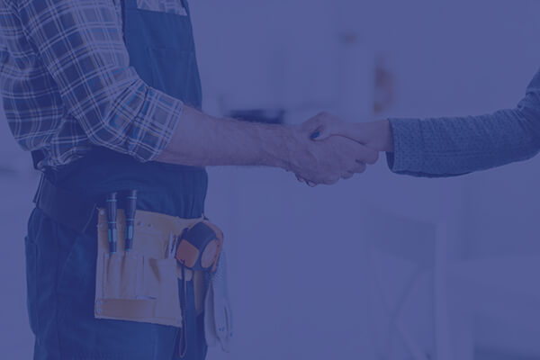 Workman shaking hands with client
